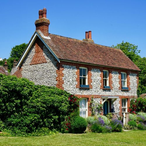 A photo of an older house with a new roof for display