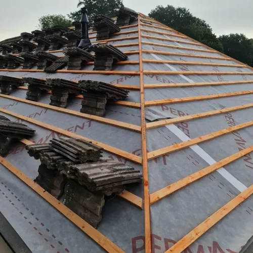 A photo showing a complete re-roof process